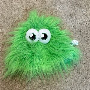 Green Furry Monster Plush hat with eyes.